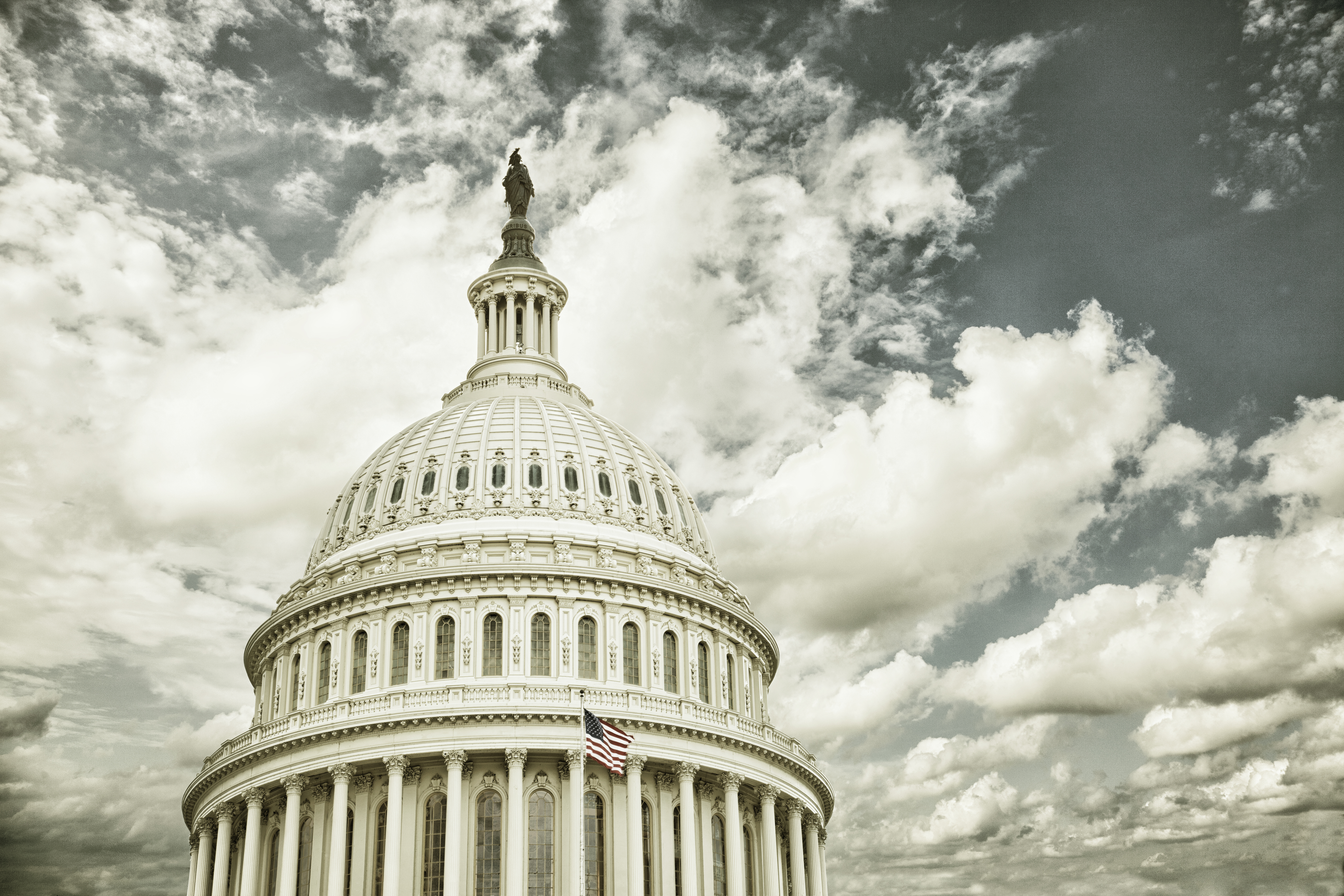 US Capitol dome with clouds